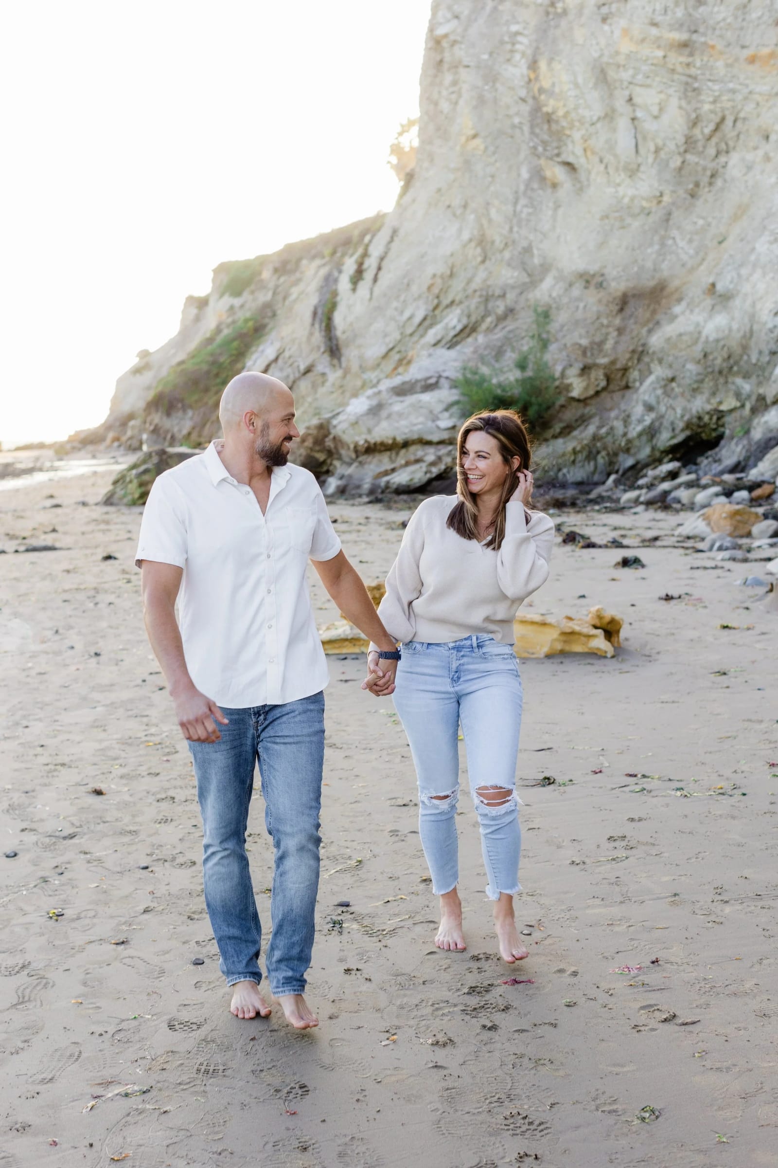 Eric and Kasee Lytle walking on the beach
